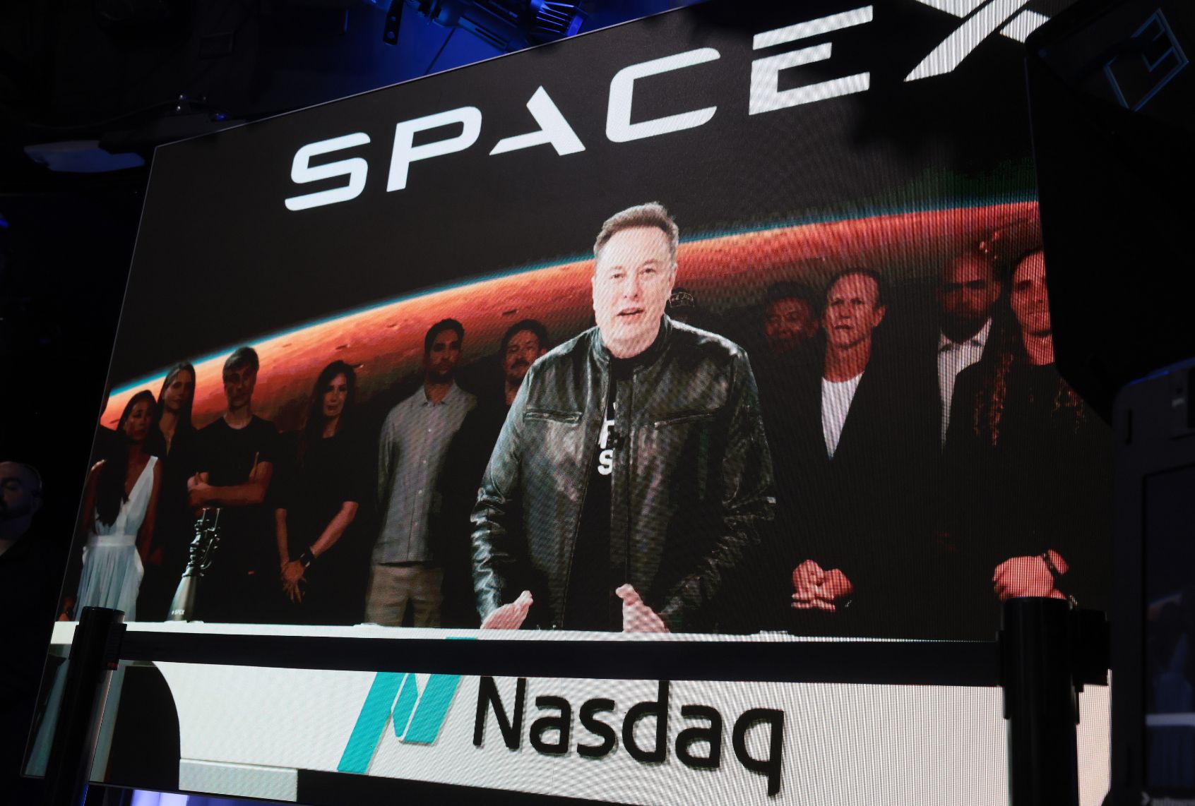 Elon Musk, founder and CEO of SpaceX, speaks via video before the ringing of opening bell at the launch of the company's initial public offering on June 12, 2026 in New York City. (Spencer Platt/Getty Images)