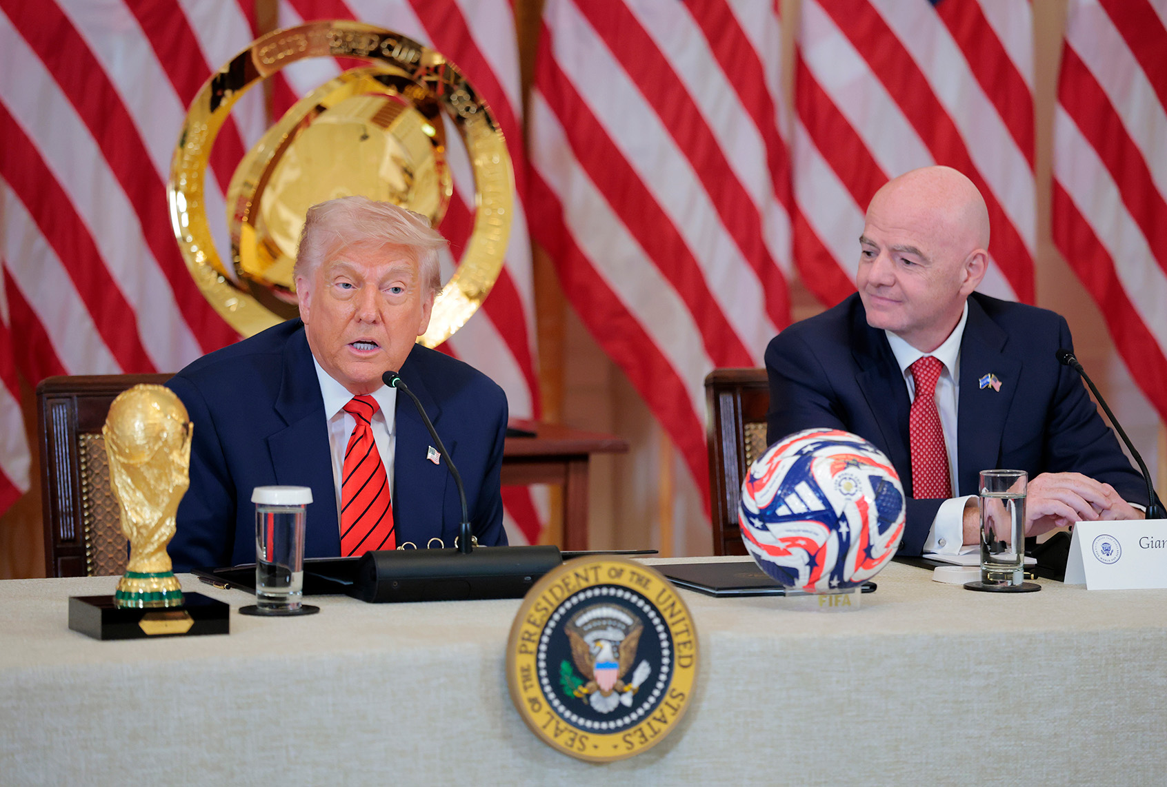U.S. President Donald Trump speaks alongside FIFA President Gianni Infantino during a meeting with the White House Task Force for the 2026 World Cup. (Anna Moneymaker / Getty Images)