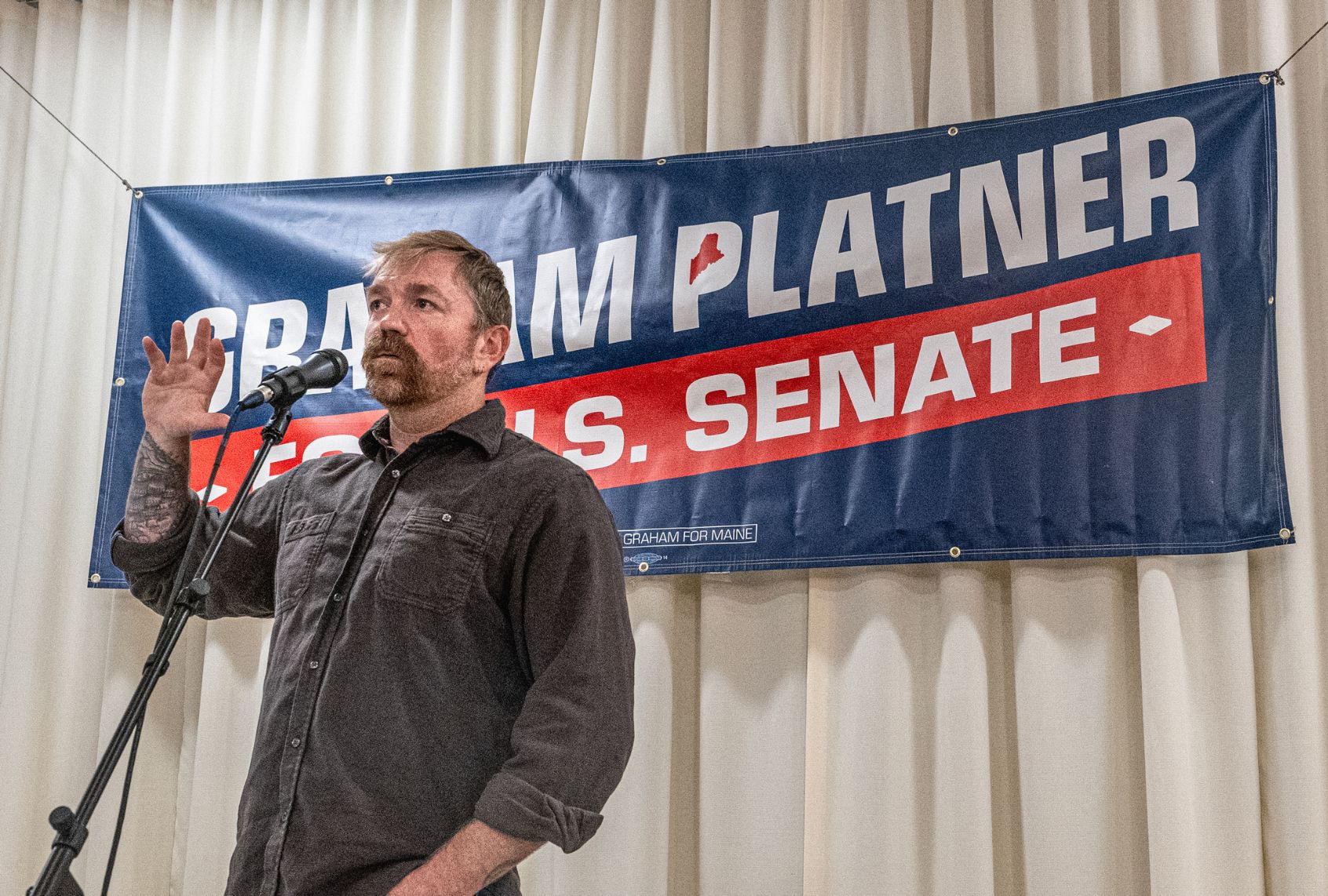Democratic U.S. Senate candidate Graham Platner speaks at a town hall on June 7, 2026 in Portland, Maine. (Laura Brett/Getty Images)