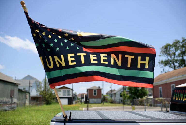 A Juneteenth flag flies on a float during the 45th annual Juneteenth National Independence Day celebrations in Galveston, Texas, on June 15, 2024. (Photo by Mark Felix / AFP via Getty Images)