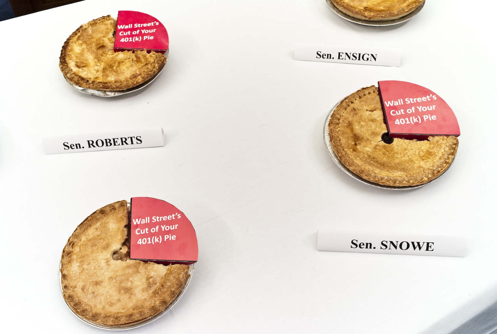 Apple pies sit on a table before a news conference with Rep. George Miller, D-Calif., on Senate Finance Chairman Max Baucus' removal from the "American Jobs and Closing Tax Loopholes Act"  of a provision that would require the disclosure of hidden 401(k) fees. Miller was sending the apple pies to the Senate panel's members, each one missing a piece to symbolize "Wall Street's cut." (Photo by Scott J. Ferrell/Congressional Quarterly/Getty Images)
