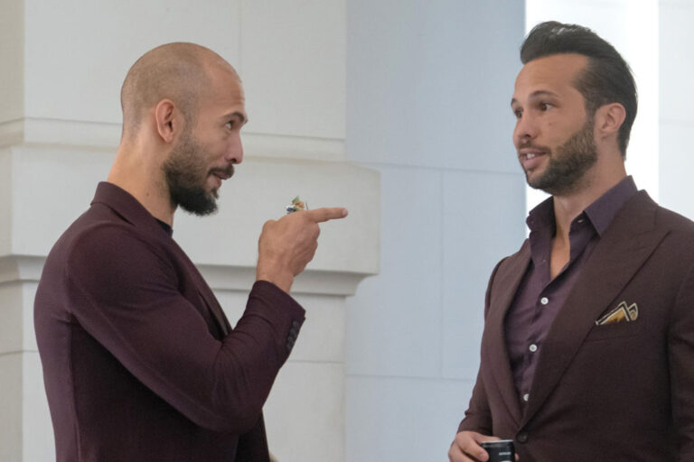 Manosphere influencers and brothers Andrew (left) and Tristan Tate have been under international legal scrutiny for years. Recently, they were arrested in Miami on rape and human trafficking charges stemming from a n active U.K. investigation. (Andrei Pungovschi / Getty Images)