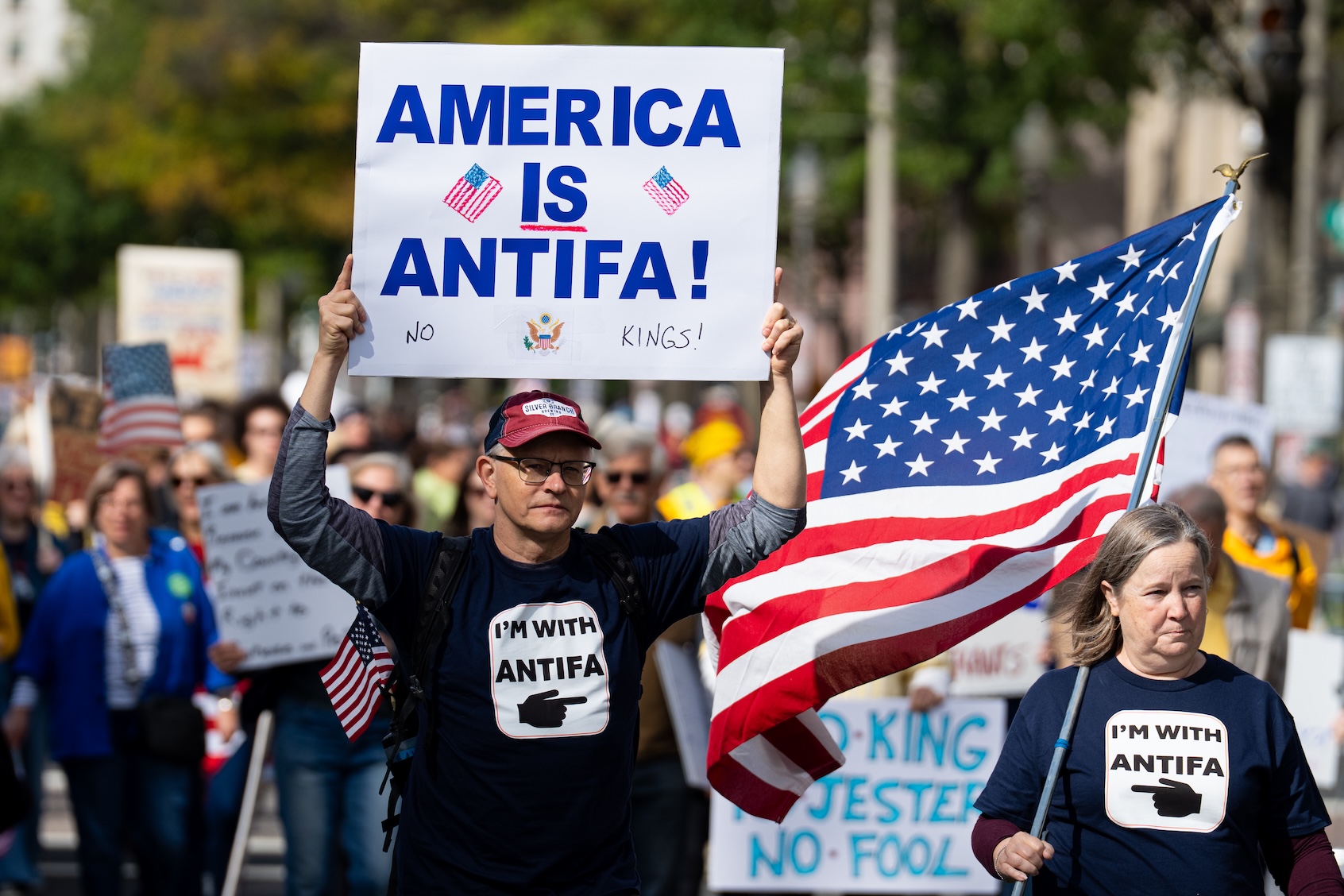 Protesters with an Antifa sign march down Pennsylvania Avenue NW for the second "No Kings" protest  in Washington on Saturday, October 18, 2025 in Washington, DC. (Photo by Bill Clark/Getty Images)