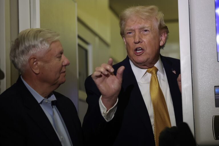 U.S. President Donald Trump (R) and U.S. Sen. Lindsey Graham (R-SC) speak to the media aboard Air Force One enroute to Washington, DC on January 04, 2026. (Photo by Joe Raedle/Getty Images)