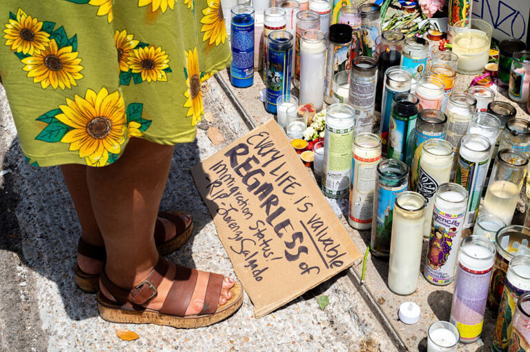 A woman pays tribute to the memory of Lorenzo Salgado Araujo, who was shot during an encouter with ICE agents in his hometown of Houston. Witnesses are challenging the official government report of justified homicide. (Brandon Bell / Getty Images)