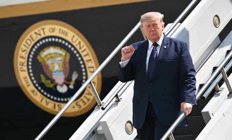 US President Donald Trump pumps his fist as he steps off Air Force One upon arrival at John F. Kennedy International Airport in New York, New York on July 17, 2026. Trump is in New York to attend a FIFA reception. (Photo by Mandel Ngan/Getty Images)