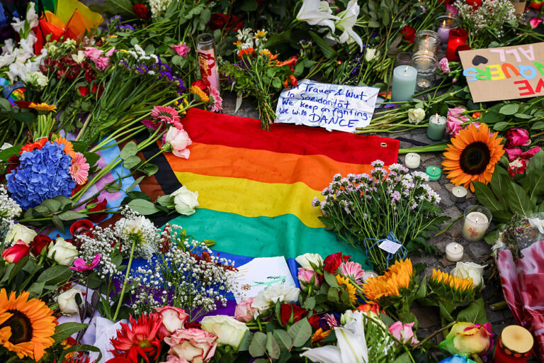 People created memorials for the dead and injured at the site where a suspect rammed a van into crowds at a German Pride festival. (Omer Messinger / Getty Images)