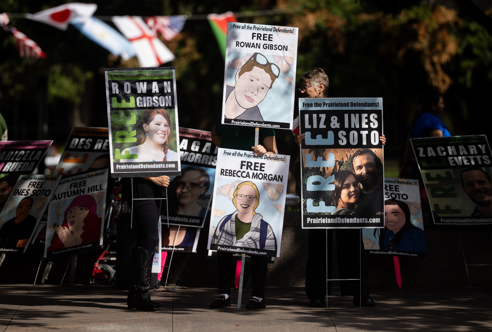 Protestors hold up signs with faces of the Prairieland defendants outside of the Eldon B. Mahon U.S. Courthouse in Fort Worth, Texas, Wednesday, July 1, 2026. (Juan Figueroa/The Dallas Morning News via Getty Images)