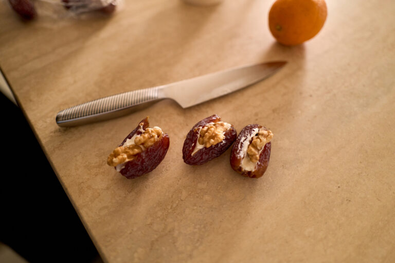 Three dates stuffed with cheese and nuts (canart7 / Getty Images)