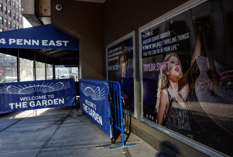 A poster featuring an image and quote from Taylor Swift is displayed outside Madison Square Garden in New York. (kena betancur / AFP via Getty Images)