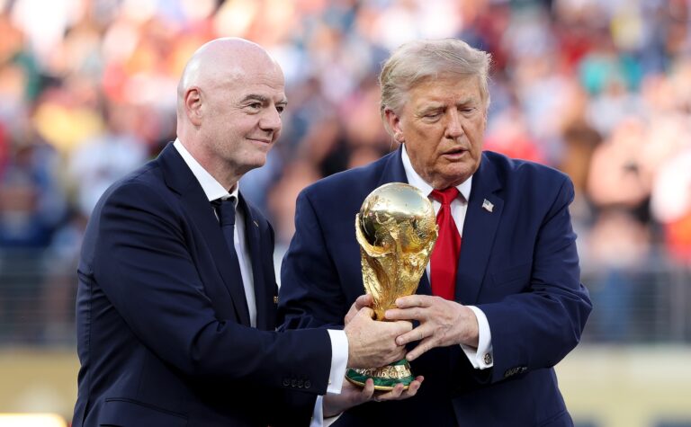 Donald Trump and FIFA President Gianni Infantino hold the FIFA World Cup winner's trophy, July 19, 2026 in East Rutherford, New Jersey. (Carl Recine/Getty Images)