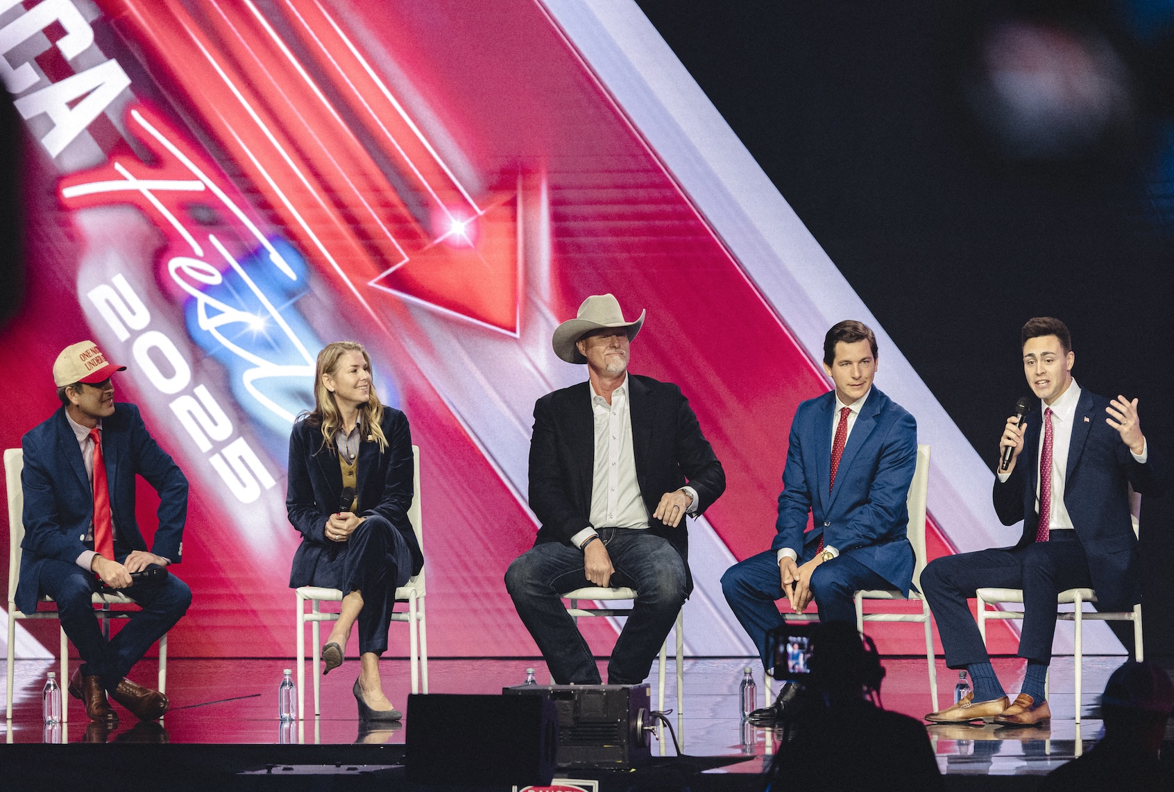 Joe Mitchell, second from right, during Turning Point USA’s annual AmericaFest conference in Phoenix, Arizona, on December 21, 2025. (Photo by Olivier Touron / AFP via Getty Images)