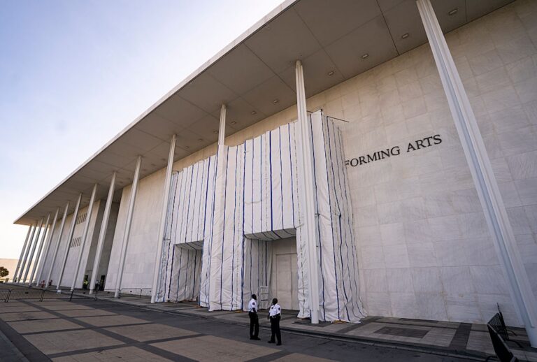 A tarp and scaffolding covers the name of the John F. Kennedy Center for the Performing Arts on June 30, 2026. (Al Drago for The Washington Post via Getty Images)