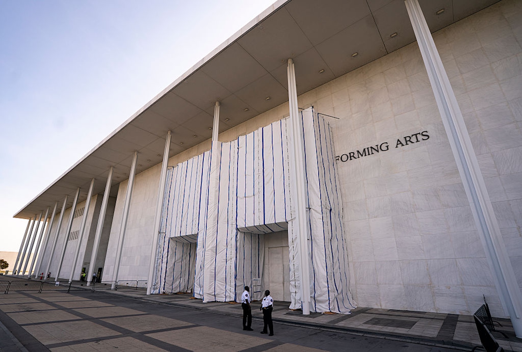 A tarp and scaffolding covers the name of the John F. Kennedy Center for the Performing Arts on June 30, 2026. (Al Drago for The Washington Post via Getty Images)