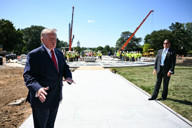 Donald Trump speaks to the press at the construction site of a helipad on the South Lawn of the White House, Aug. 19, 2026. (Jim Watson/AFP via Getty Images)