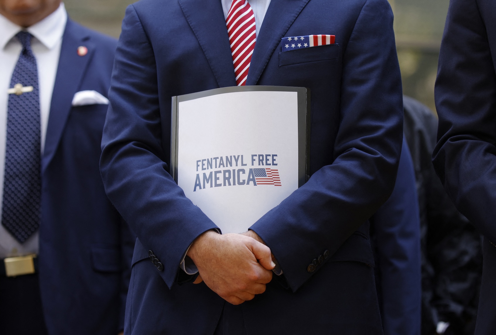 Terrance Cole, Administrator of the Drug Enforcement Administration holds a folder reading "Fentanyl free America" during a news conference with law enforcement officials outside the federal courthouse in the Brooklyn borough of New York City on July 20, 2026. (Photo by Leonardo MUNOZ / AFP via Getty Images)