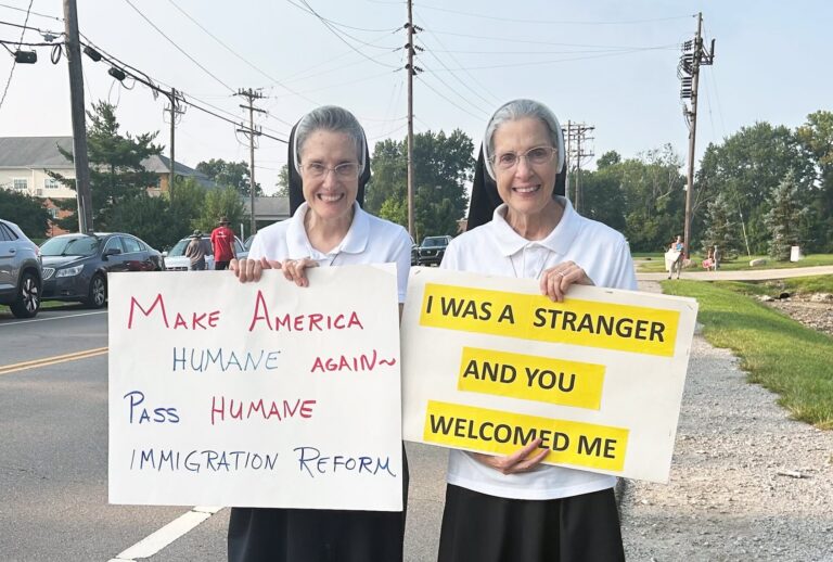 Sisters Anita Marie and Maria Francine with the Sisters of Notre Dame supported Haitian immigrants summoned to an ICE facility in Blue Ash, Ohio, on August 9, 2026. (The 19th/Amanda Becker)