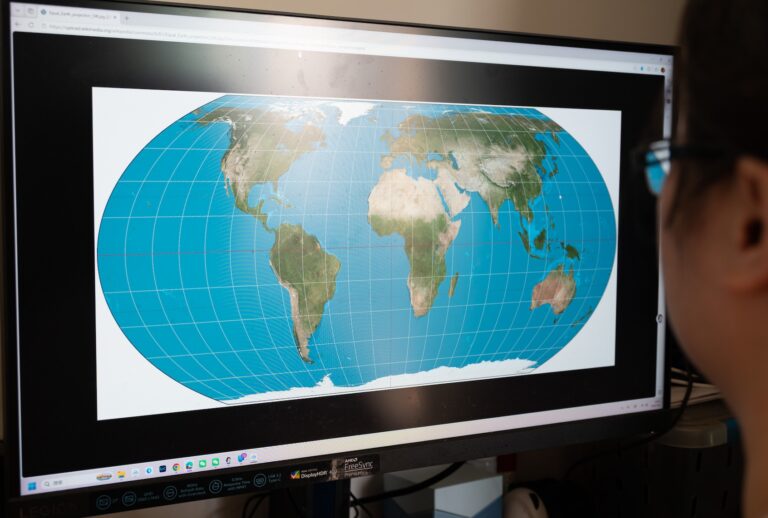 SHANGHAI, CHINA - SEPTEMBER 06 2026: A man checks the "Equal Earth" map projection on a screen in Shanghai, China, Sunday, Sept. 6, 2026. The United Nations General Assembly recently endorsed the non-binding resolution to promote the projection, which aims to correct geographical distortions caused by the traditional Mercator map.