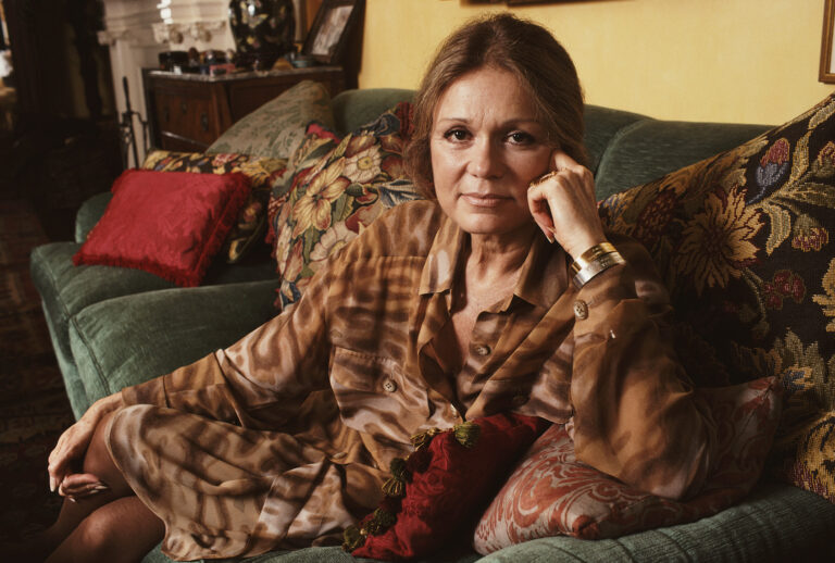 Feminist activist and journalist Gloria Steinem sits in her New York City apartment, Nov. 2, 1990. (Barbara Alper / Getty Images)