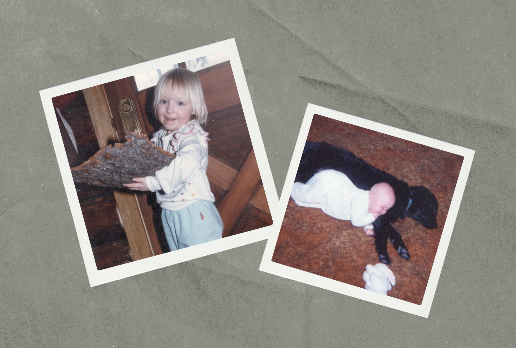 Two vintage snapshots on a gray background. Left: A smiling blond toddler in a white sweatshirt holds a large piece of tree bark inside a wood-paneled cabin. Right: A baby in a white sleeper lies across a sleeping black dog on a brown carpet, with a stuffed white bunny nearby.