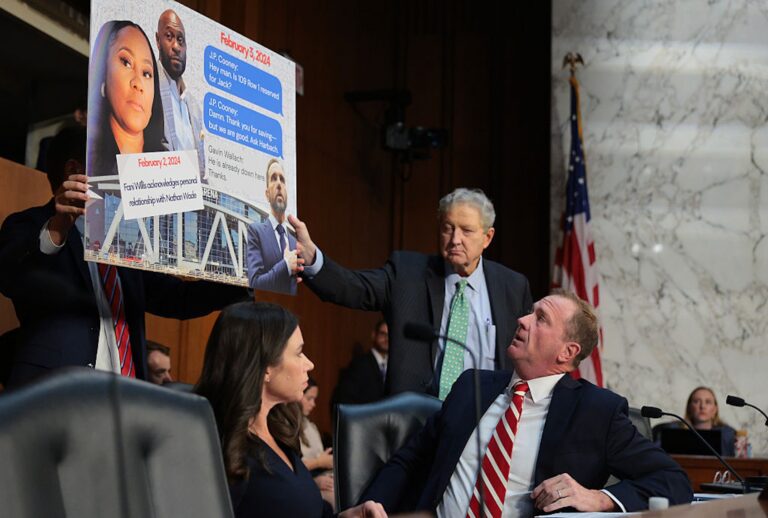 Sen. Eric Schmitt, R-Mo., and Sen. John Kennedy, R-La., display a sign accusing former special counsel Jack Smith of meeting with Fulton County District Attorney Fani Willis during a hearing before the Senate Judiciary Committee on Sept. 29, 2026. ( Chip Somodevilla/Getty Images)