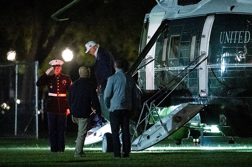 President Trump arrives back at the White House at night. His current crusade is to eliminate standard time so that he doesn't have to "come home in the dark." (Graeme Sloan / Getty Images)