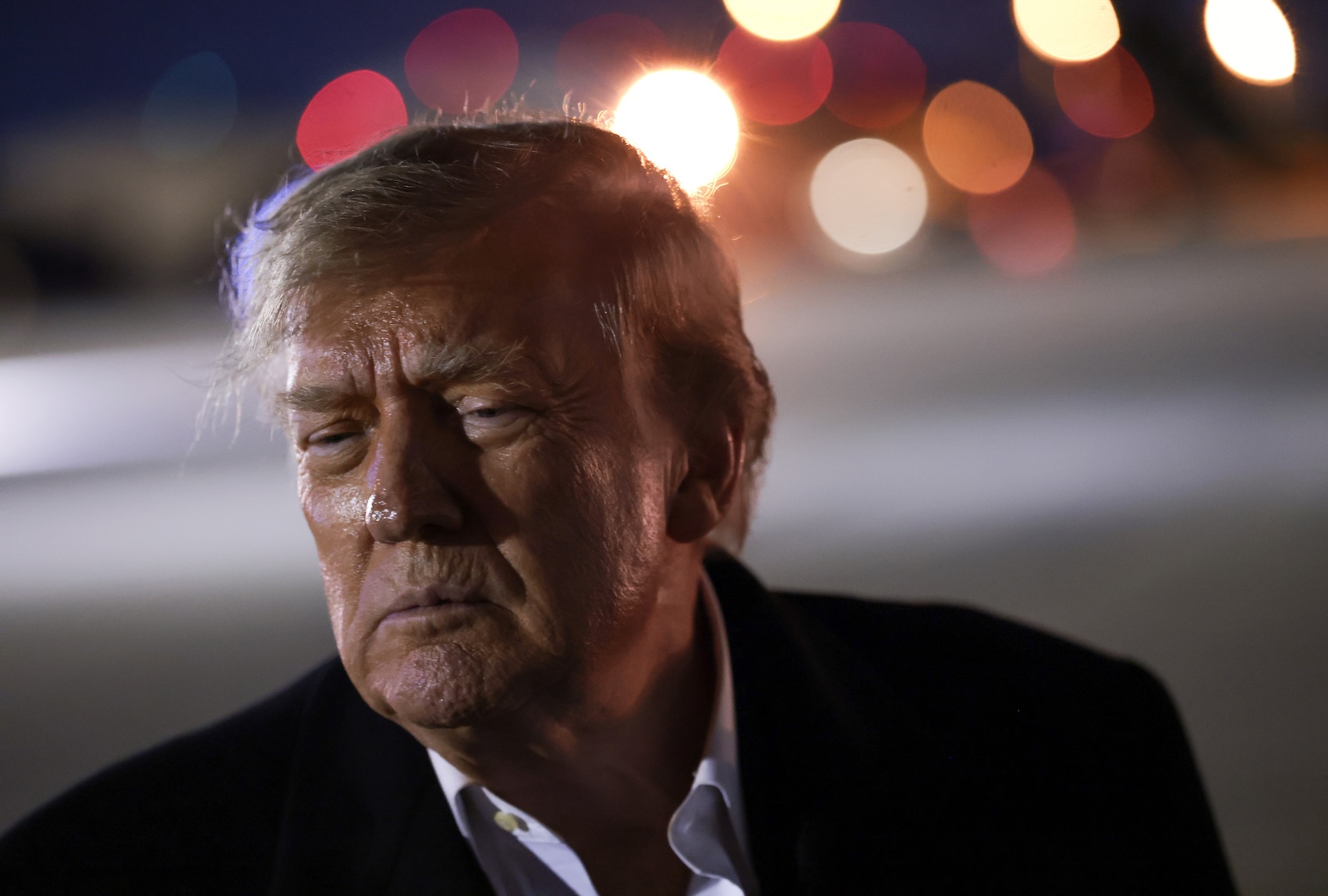 Donald Trump speaks to reporters alongside former professional boxer Evander Holyfield on October 21, 2026 in Joint Base Andrews, Maryland. (Photo by Anna Moneymaker/Getty Images)
