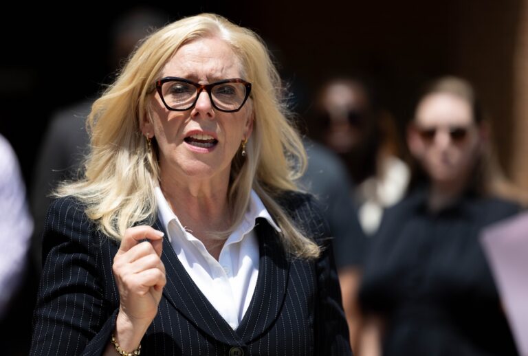Shannon Taylor, the Henrico Commonwealth's Attorney, speaks to members of the press, surrounded by the families of Erin Strotman's victims in front of the L.A. Harris, Jr. Courts Building following the Strotman's sentencing, Friday, June 5, 2026, in Henrico, Va. (Mike Kropf/Richmond Times-Dispatch via Getty Images)