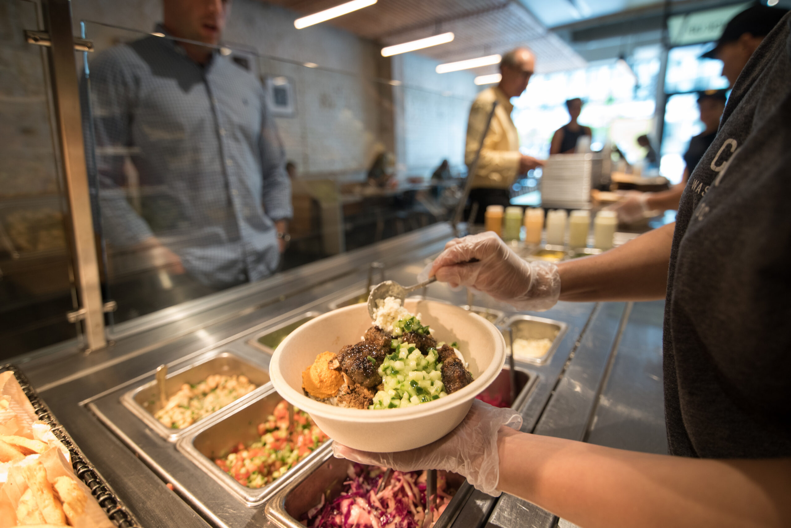 Employee making a bowl at Cava (Dixie D. Vereen/For The Washington Post via Getty Images)