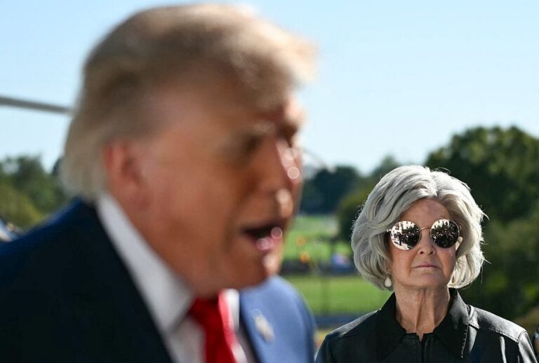 White House chief of staff Susie Wiles looks on as President Donald Trump speaks to the press before walking to board Marine One on the South Lawn of the White House on Oct. 6, 2026. (Alex WROBLEWSKI / AFP via Getty Images)