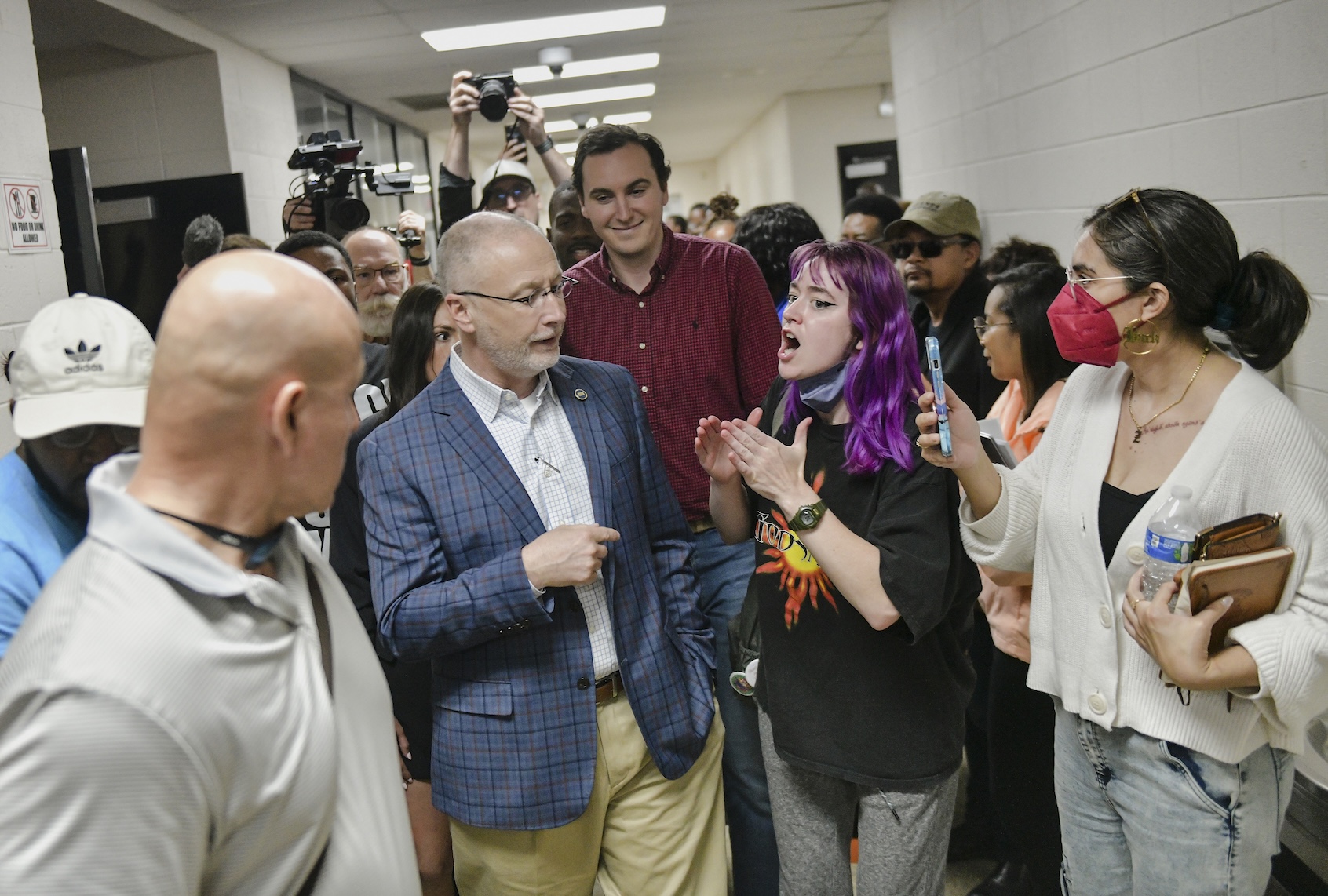 An attendee confronts Tennessee State Sen. Brent Taylor, center left, during a public comment meeting hosted by the Shelby County Health Department at Fairley High School on xAI’s permit application to use gas turbines for a new data center in Memphis, TN on April 25, 2025. (Photo by Brandon Dill for The Washington Post via Getty Images)