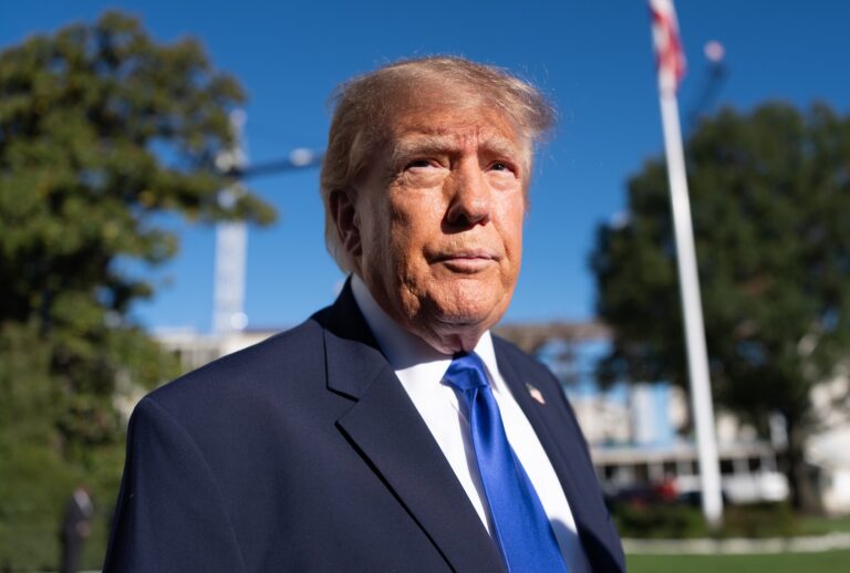 Donald Trump speaks to the media o the South Lawn before departing the White House on October 22, 2026 in Washington, DC. (Photo by Aaron Schwartz/Getty Images)