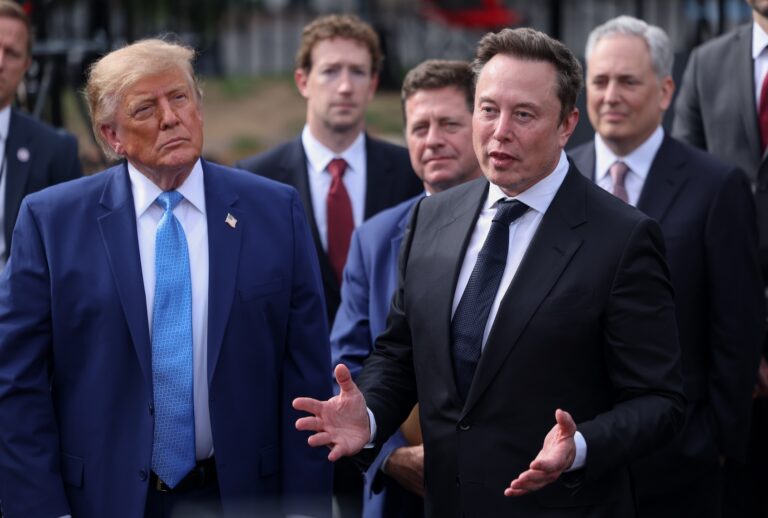 Tesla, X and SpaceX CEO Elon Musk speaks to reporters as President Donald Trump looks on outside the White House on Tuesday, Sept. 29, 2026 in Washington, D.C. Trump held a meeting on super intelligence earlier with tech CEOs in the East Room. (Tierney L. Cross/Pool/For The Washington Post via Getty Images)