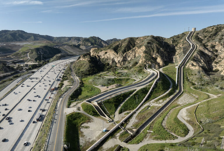 The Los Angeles Aqueduct winds through the hills alongside a freeway in Sylmar, California, on Wednesday, Jan. 28, 2026. (Myung J. Chun / Los Angeles Times via Getty Images)