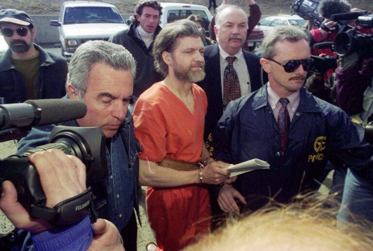 Theodore "Ted" Kaczynski, center, is escorted by federal marshals to his arraignment in Helena, Montana, on April 4, 1996. (Michael Macor/The San Francisco Chronicle via Getty Images)