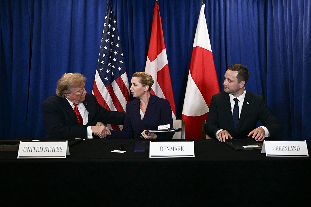President Donald Trump shakes hands with Danish Prime Minister Mette Frederiksen as Greenland Prime Minister Jens-Frederik Nielsen looks on after signing a security deal at the U.N. in New York, Sept. 22, 2026. (Brendan Smialowski/AFP via Getty Images)