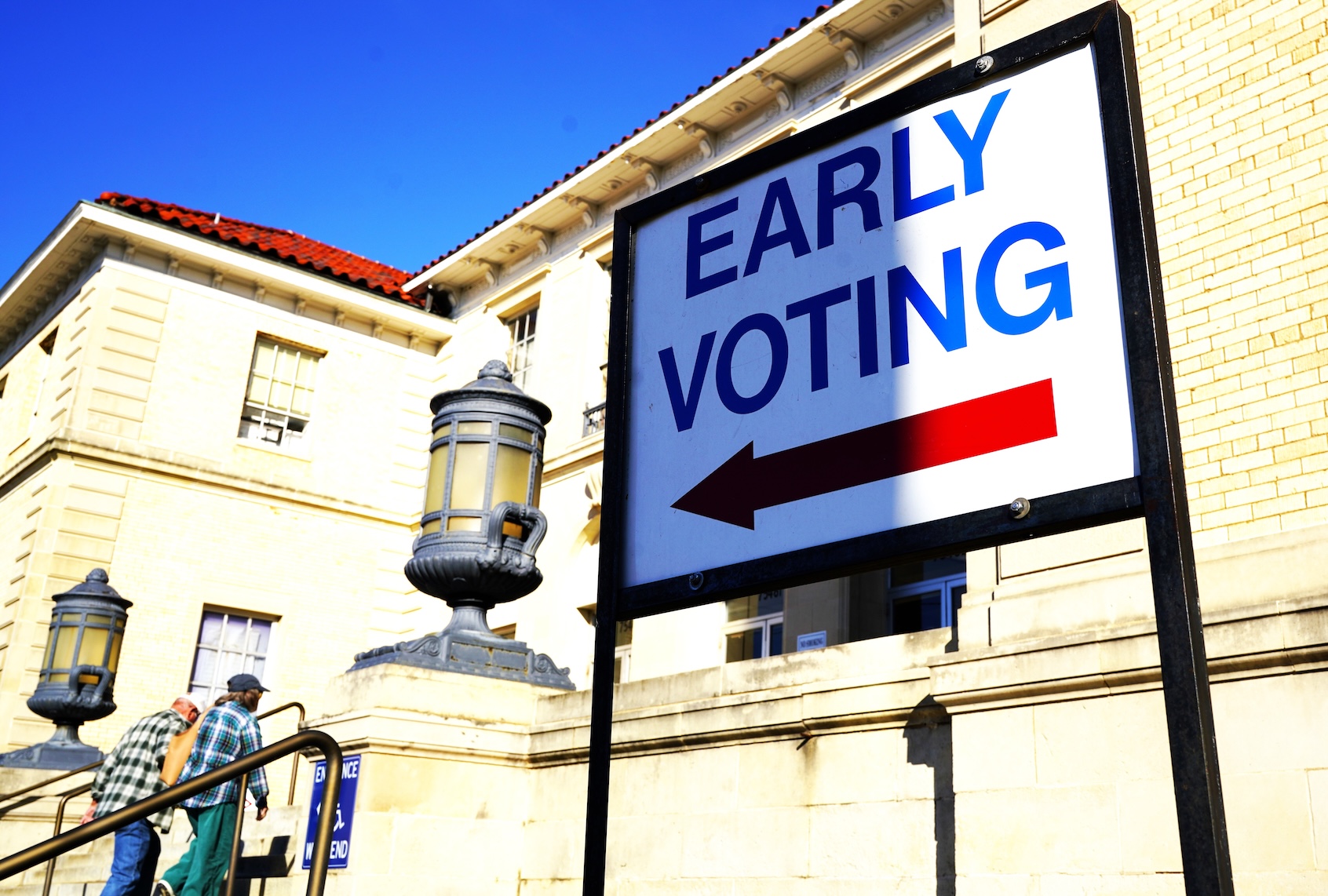 People go to a polling station after early voting for the Nov. 3 U.S. midterm elections started, in Paris, Texas, the United States on Oct. 22, 2026. (Photo by Wu Xiaoling/Xinhua via Getty Images)